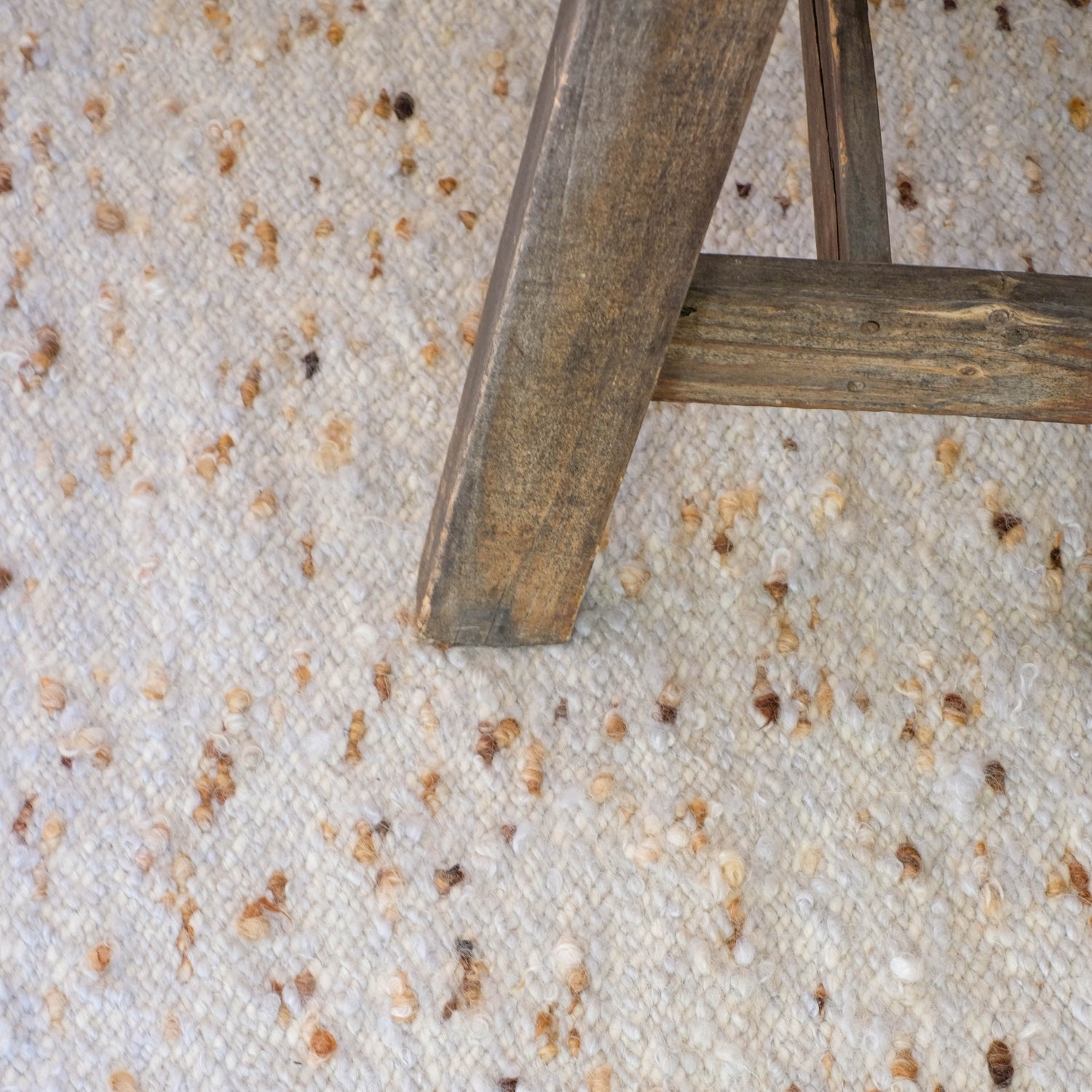 Handwoven merino wool rug with colour details