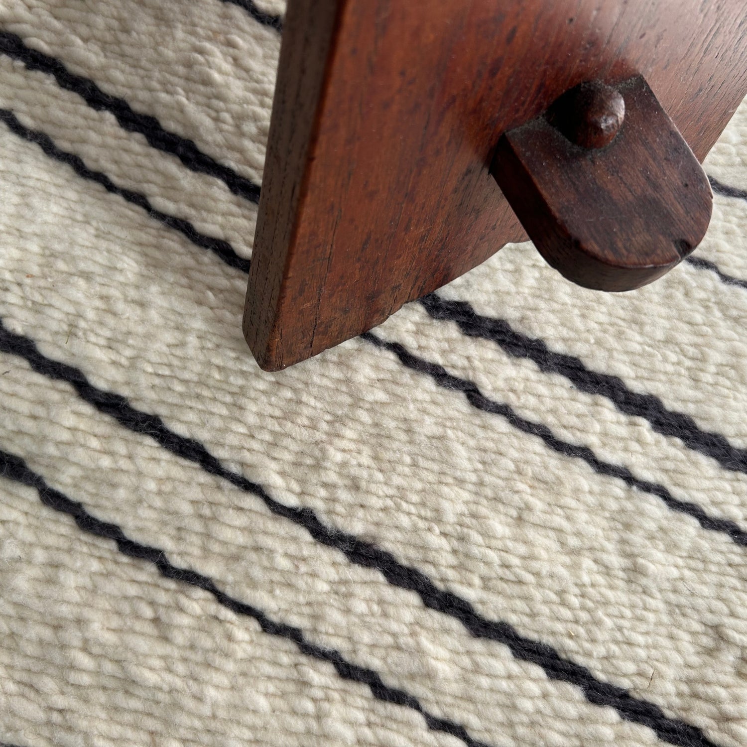 Handwoven merino wool rug with a stripe